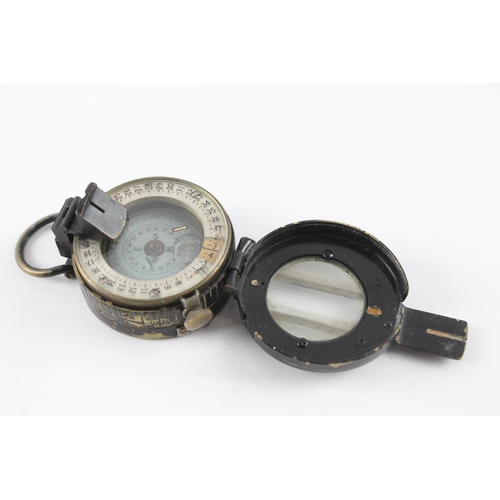 2374 - A T.G. & Co WWII British fluid filled military compass, dated 1943