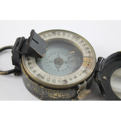 2374 - A T.G. & Co WWII British fluid filled military compass, dated 1943