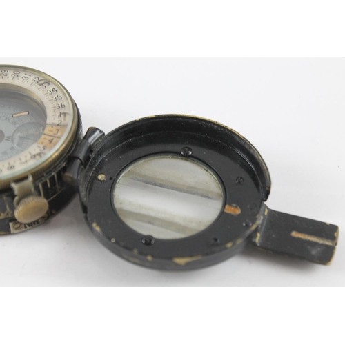 2374 - A T.G. & Co WWII British fluid filled military compass, dated 1943