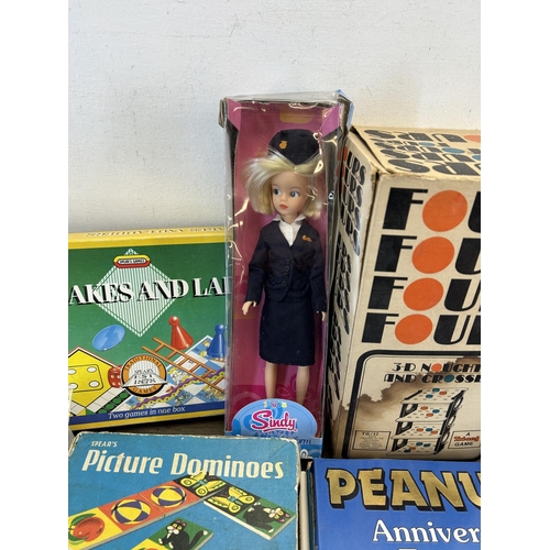 1330 - A collection of toys and games to include Tri-ang 3D noughts and crosses, Sindy Classic cabin crew d... 