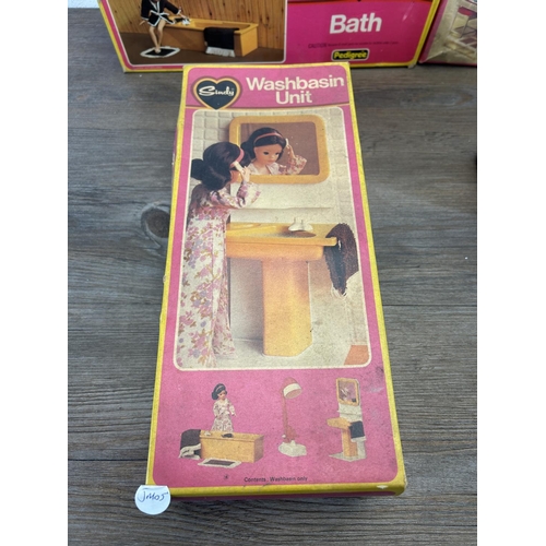 1338 - Five mid 20th century Sindy items, one washbasin unit, one sideboard, one bath, one dining table and... 