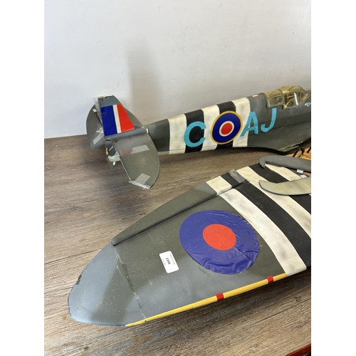 1346 - A Spitfire model aeroplane with pilot - wing span approx. 140cm, plane body approx. 112cm long