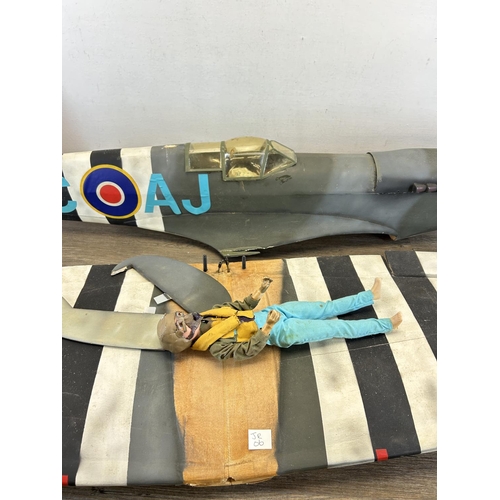 1346 - A Spitfire model aeroplane with pilot - wing span approx. 140cm, plane body approx. 112cm long