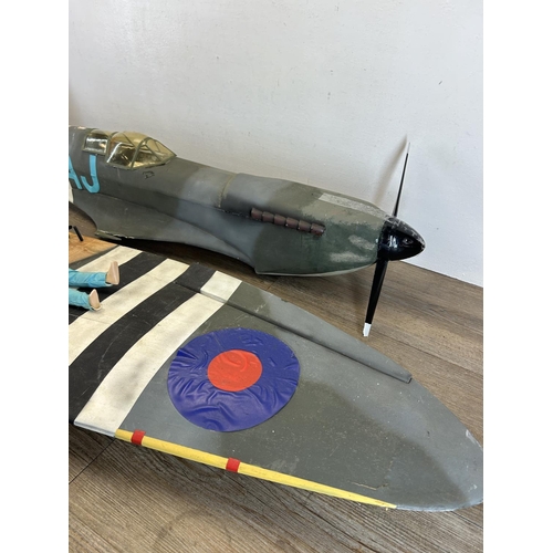 1346 - A Spitfire model aeroplane with pilot - wing span approx. 140cm, plane body approx. 112cm long