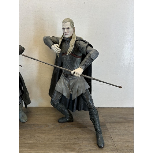 1347 - A collection of toys and figurines to include NLP Inc. legolas, NLP inc. Aragorn etc.