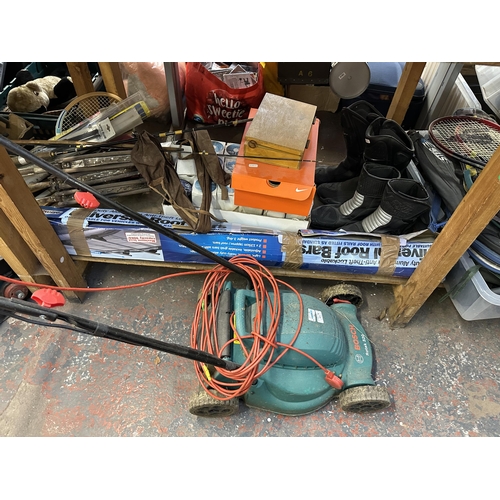 1603 - A collection of house clearance items to include Bosch Rotak 320, metalware, sports equipment, frame... 