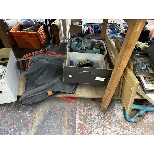 1603 - A collection of house clearance items to include Bosch Rotak 320, metalware, sports equipment, frame... 