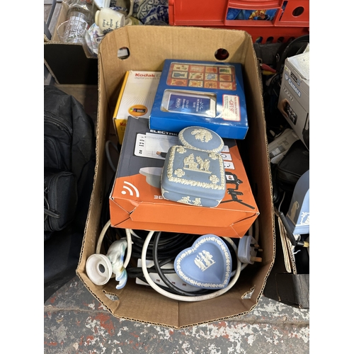 1633 - Two boxes containing Wedgwood blue Jasperware, IP Camera, Kodak SV710 digital picture frame etc.