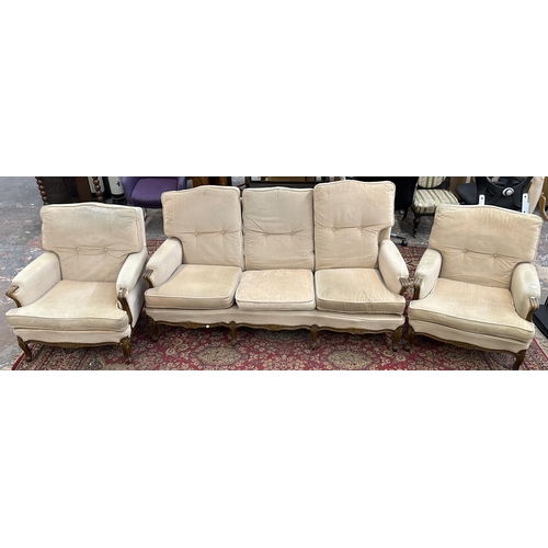 1161 - A French Louis XV style carved beech and fabric upholstered three piece lounge suite comprising thre... 