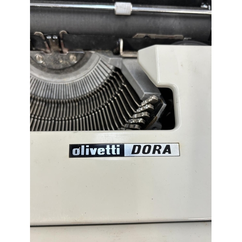 1524 - Two cased portable typewriters, one Empire Aristocrat and one Olivetti Dora