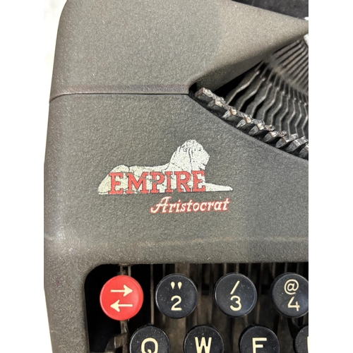 1524 - Two cased portable typewriters, one Empire Aristocrat and one Olivetti Dora