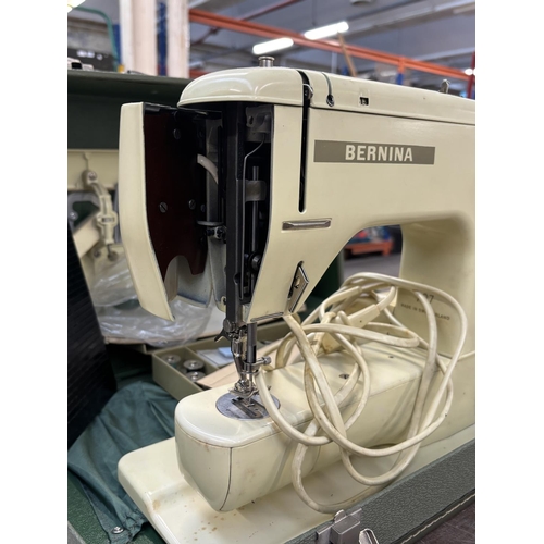 1527 - A cased Bernina Minimatic electric sewing machine with attachments, accessories, power cable, foot p... 