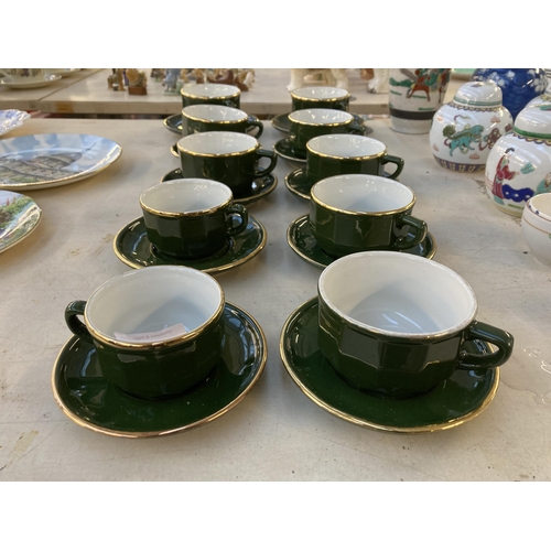 1278 - Twenty Apilco of France green and gold ceramic cups and saucers