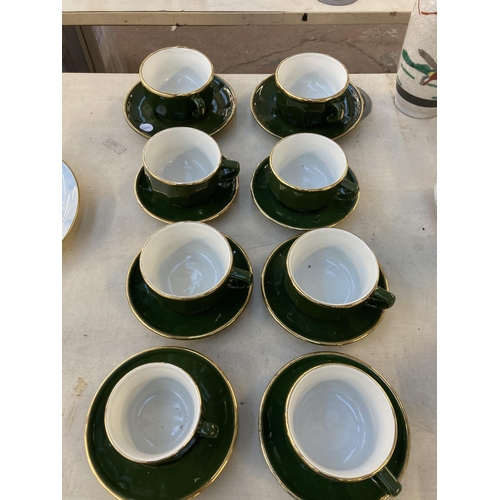 1278 - Twenty Apilco of France green and gold ceramic cups and saucers