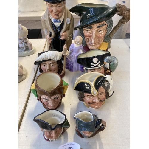 1283 - Ten pieces of Royal Doulton ceramics, one Rose HN2123 figurine and nine character jugs to include Pi... 