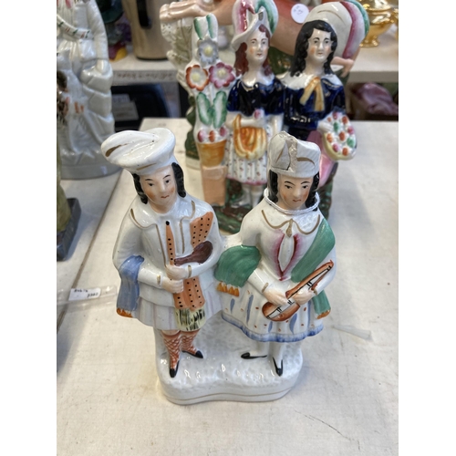 1289 - Ten Staffordshire hand painted pottery flatback figurines