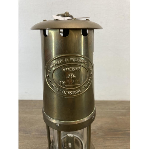 1306 - An E. Thomas & Williams Ltd of Aberdare Wales brass miner's lamp - approx. 26cm high