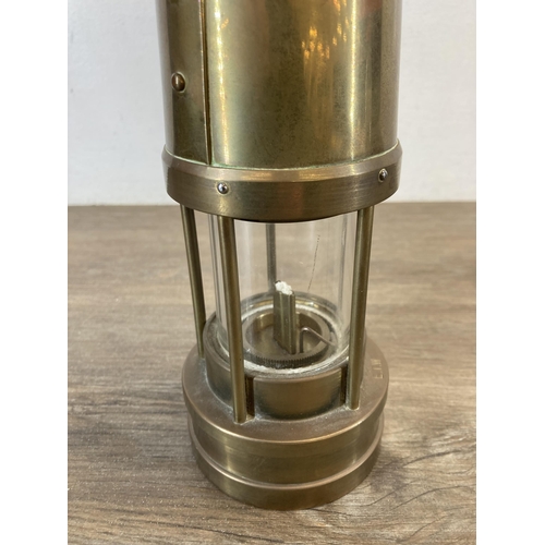 1306 - An E. Thomas & Williams Ltd of Aberdare Wales brass miner's lamp - approx. 26cm high