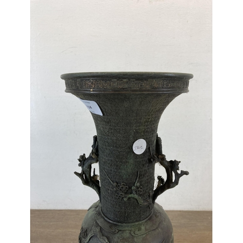 1314 - A Japanese Meiji period bronze twin handled vase with bird and foliate decoration - approx. 41cm hig... 