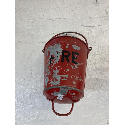 1320 - Two vintage painted galvanised fire buckets - approx. 34cm high