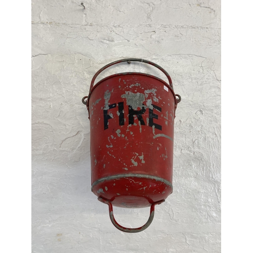 1320 - Two vintage painted galvanised fire buckets - approx. 34cm high