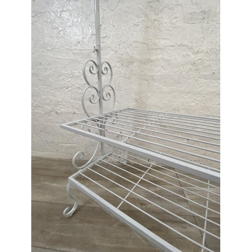 1115 - A white painted wrought metal coat stand - approx. 186cm high x 106cm wide x 55cm deep