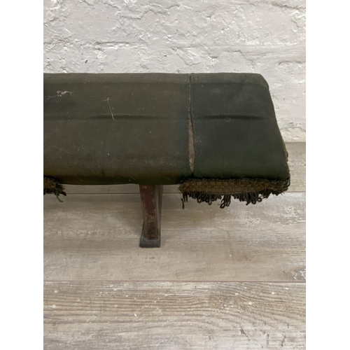 1117 - A Victorian pine and green fabric upholstered prayer stool - approx. 22cm high x 138cm wide x 24cm d... 