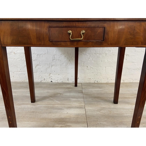 1119 - A George III inlaid mahogany fold over tea table - approx. 74cm high x 89cm wide x 45cm deep not ext... 