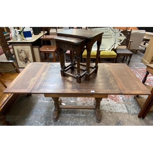 1120 - Two pieces of oak furniture, one nest of two tables and one 1930s draw leaf dining table - approx. 7... 