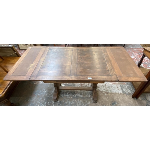 1120 - Two pieces of oak furniture, one nest of two tables and one 1930s draw leaf dining table - approx. 7... 