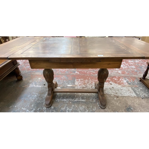 1120 - Two pieces of oak furniture, one nest of two tables and one 1930s draw leaf dining table - approx. 7... 