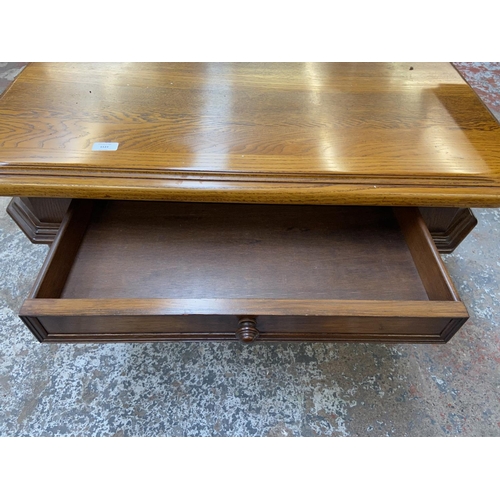 1123 - An oak coffee table - approx. 49cm high x 97cm wide x 97cm deep