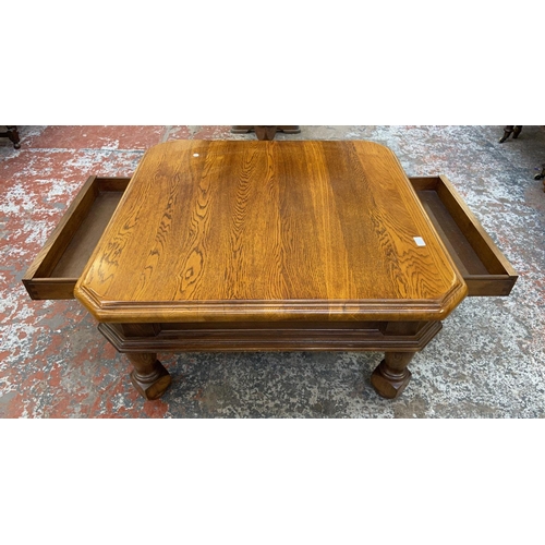 1123 - An oak coffee table - approx. 49cm high x 97cm wide x 97cm deep