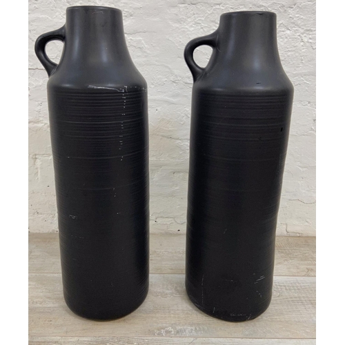 1124 - A pair of Dunelm black ceramic 58cm vases