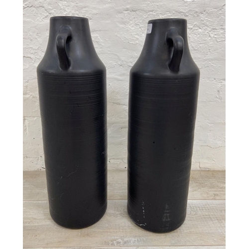 1124 - A pair of Dunelm black ceramic 58cm vases