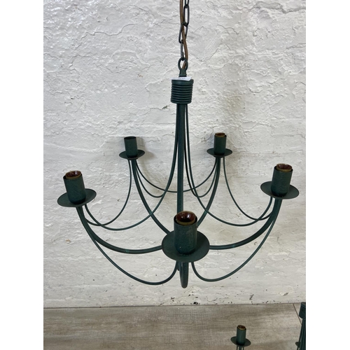 1126 - Three green painted wrought metal chandeliers