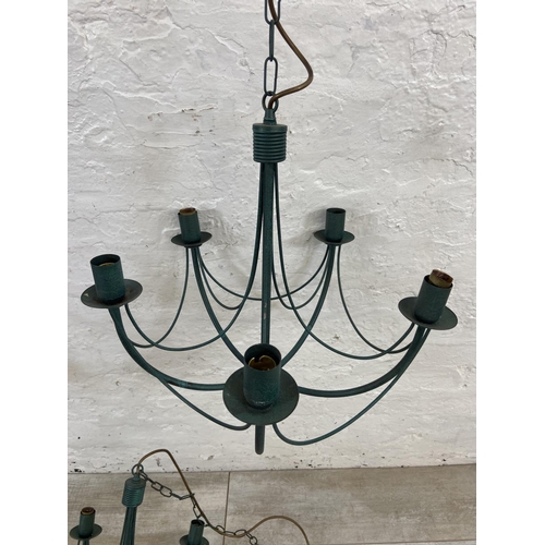 1126 - Three green painted wrought metal chandeliers