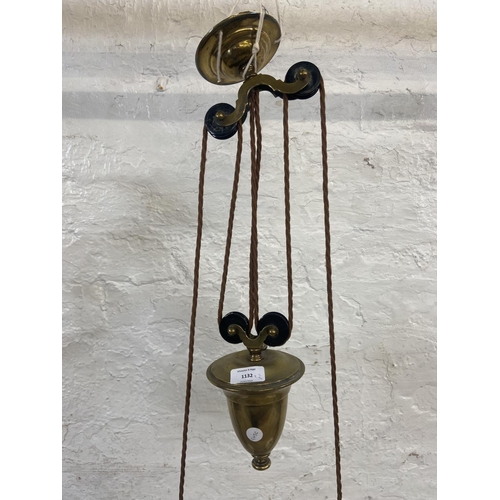 1132 - An early 20th century brass twin branch rise and fall ceiling light with opaline glass shades togeth... 