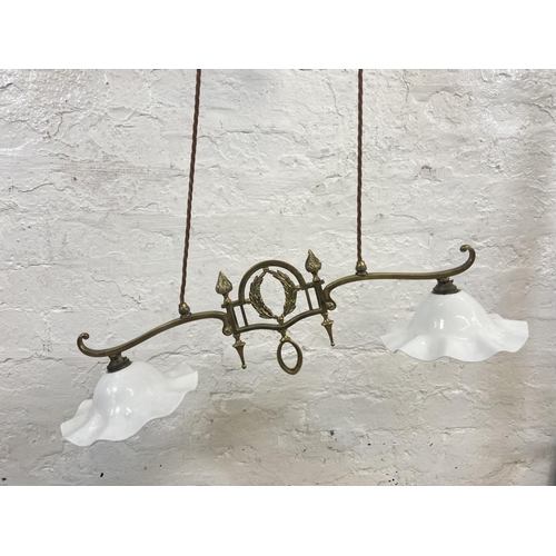 1132 - An early 20th century brass twin branch rise and fall ceiling light with opaline glass shades togeth... 