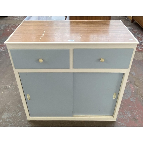 1135C - A mid 20th century blue and white painted kitchen cabinet with laminate top - approx. 85cm high x 84... 