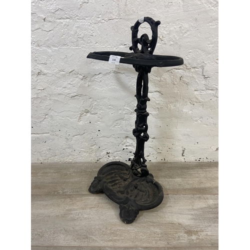 1146 - A Victorian style cast iron two section stick stand - approx. 58cm high