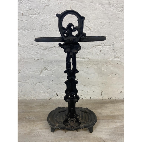 1146 - A Victorian style cast iron two section stick stand - approx. 58cm high