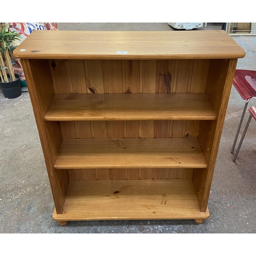 1149 - A modern pine three tier bookcase - approx. 100cm high x 84cm wide x 28cm deep