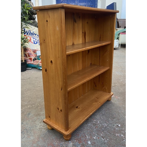 1149 - A modern pine three tier bookcase - approx. 100cm high x 84cm wide x 28cm deep