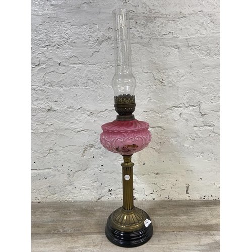 1158 - A Victorian Duplex brass oil lamp with hand painted pink glass reservoir, etched glass shade and cle... 