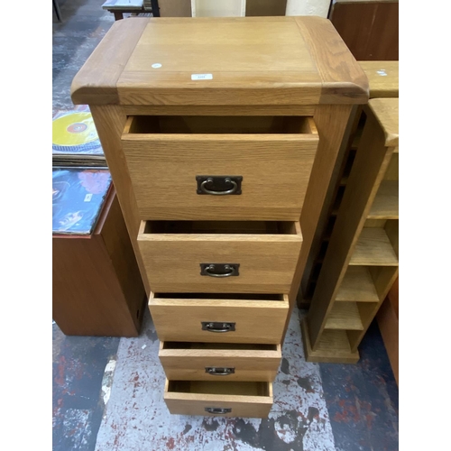 1162 - A modern oak chest of drawers - approx. 130cm high x 55cm wide x 40cm deep