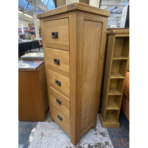 1162 - A modern oak chest of drawers - approx. 130cm high x 55cm wide x 40cm deep