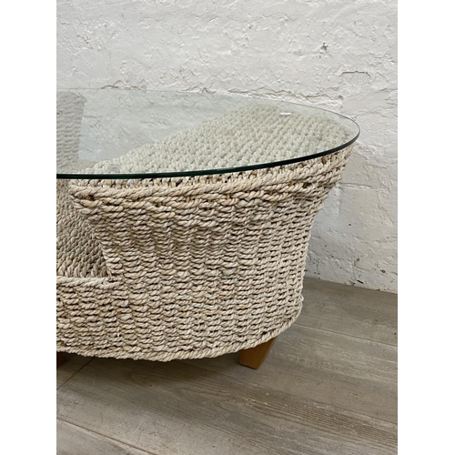 1166 - A modern wicker and glass top coffee table - approx. 42cm high x 61cm wide x 96cm long