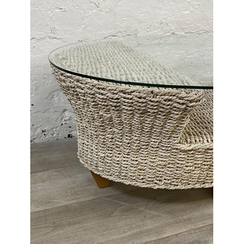 1166 - A modern wicker and glass top coffee table - approx. 42cm high x 61cm wide x 96cm long