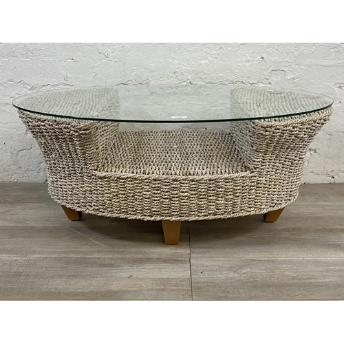 1166 - A modern wicker and glass top coffee table - approx. 42cm high x 61cm wide x 96cm long